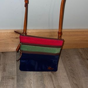 Dooney and Burke navy green red and brown cross body purse. Sizing: 7.5 W x 8”H.
